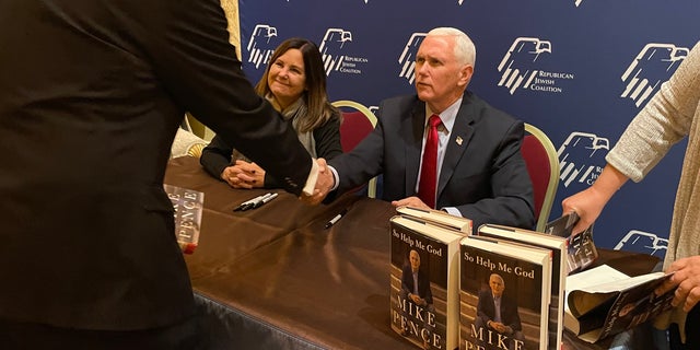 Former Vice President Mike Pence and his wife Karen during a book signing at the Jewish Republican Coalition's annual leadership conference on November 18, 2022 in Las Vegas