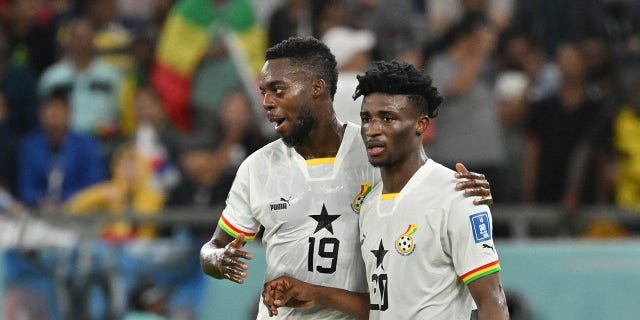 Ghana midfielder Mohammed Kudus, #20, celebrates scoring his team's third goal with Ghana forward Inaki Williams, #19, during the Qatar 2022 World Cup Group H soccer match between South Korea and Ghana at the Education City Stadium in Al-Rayyan, west of Doha, Qatar, on November 28, 2022.