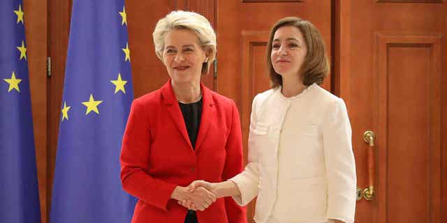 European Commission President Ursula von der Leyen, left, shakes hands with Moldovan President Maia Sandu after a joint news conference in Chisinau, Moldova November 10, 2022.
