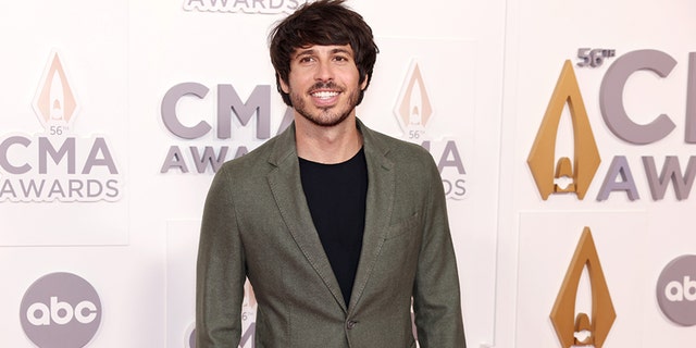Morgan Evans is excited to see Luke Bryan and Peyton Manning host the show.