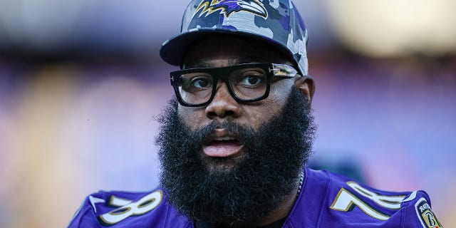 Morgan Moses #78 of the Baltimore Ravens warms up before the game against the Tennessee Titans on August 11, 2022 at M&T Bank Stadium in Baltimore.