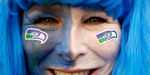 A fan of the Seahawks arrives at the Allianz Arena in Munich, Germany, Sunday, Nov. 13, 2022.