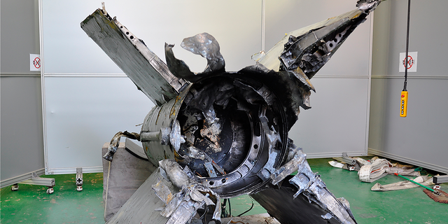 This undated photo provided by South Korean Defense Ministry shows the retrieved debris of a missile in South Korea's East Sea which it identified as a North Korea's SA-5 surface-to-air missile.