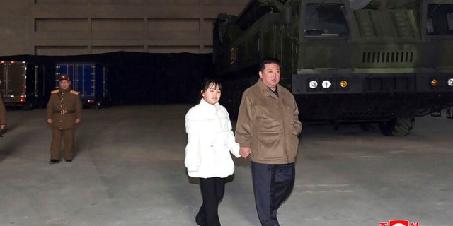 This photo provided on Nov. 19, 2022 by the North Korean government shows North Korean leader Kim Jong Un, right, and his daughter inspecting a missile at the Pyongyang International Airport in Pyongyang, North Korea on Friday, Nov. 18, 2022. State media from the North Korea said its leader Kim oversaw the launch of the Hwasong-17 missile, a day after its neighbors said they detected the launch of an ICBM potentially capable of reaching the continental United States.  in this picture.  The content of this image is as supplied and cannot be independently verified.  The Korean language watermark on the image as provided by the source reads: "KCN extension" which is short for Korean Central News Agency. 