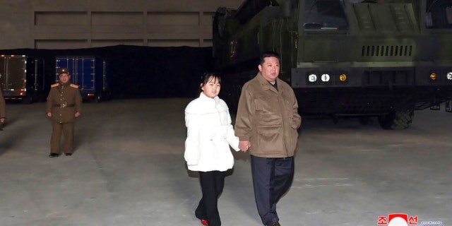 This photo provided on Nov. 19, 2022 by the North Korean government shows North Korean leader Kim Jong Un, right, and his daughter inspecting a missile at the Pyongyang International Airport in Pyongyang, North Korea on Friday, Nov. 18, 2022. State media from the North Korea said its leader Kim oversaw the launch of the Hwasong-17 missile, a day after its neighbors said they detected the launch of an ICBM potentially capable of reaching the continental United States.  in this picture.  The content of this image is as supplied and cannot be independently verified.  The Korean language watermark on the image as provided by the source reads: "KCN extension" which is short for Korean Central News Agency. 