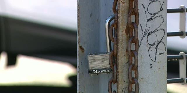 Broken lock at Carsiri car dealership in Queens, New York