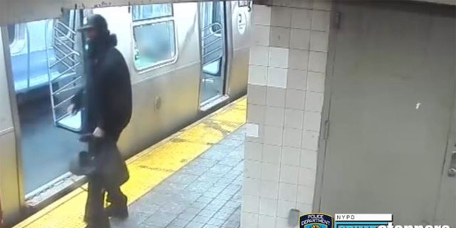 Surveillance footage from NYPD showing the fight spill onto the subway platform. 