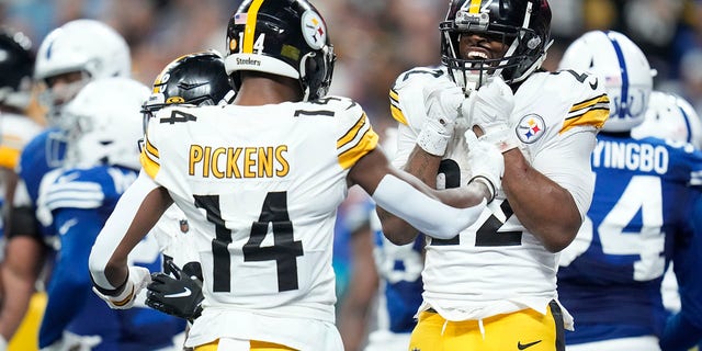 Pittsburgh Steelers running back Najee Harris (22) celebrates a touchdown run with George Pickens (14) during the first half of an NFL football game against the Indianapolis Colts, Monday, November 28, 2022, in Indianapolis.