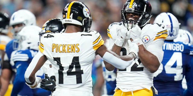 Pittsburgh Steelers running back Najee Harris (22) celebrates a touchdown run with George Pickens (14) during the first half of an NFL football game against the Indianapolis Colts, Monday, Nov. 28, 2022, in Indianapolis.