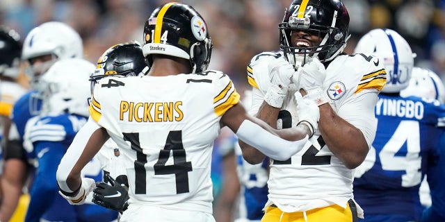 Pittsburgh Steelers running back Najee Harris (22) celebrates a touchdown run with George Pickens (14) during the first half of an NFL football game against the Indianapolis Colts, Monday, November 28, 2022, in Indianapolis.