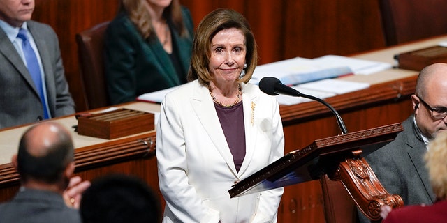 House Speaker Nancy Pelosi acknowledges applause from lawmakers after speaking on the House floor at the Capitol on Thursday.