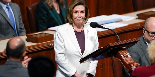 House Speaker Nancy Pelosi acknowledges applause from lawmakers after speaking on the House floor at the Capitol on Thursday.