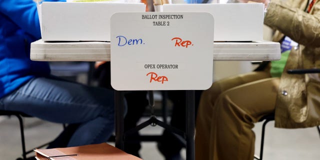 Ballots are processed by bipartisan election workers at the Clark County Election Department during the ongoing election process on Nov. 10, 2022, in North Las Vegas, Nevada.