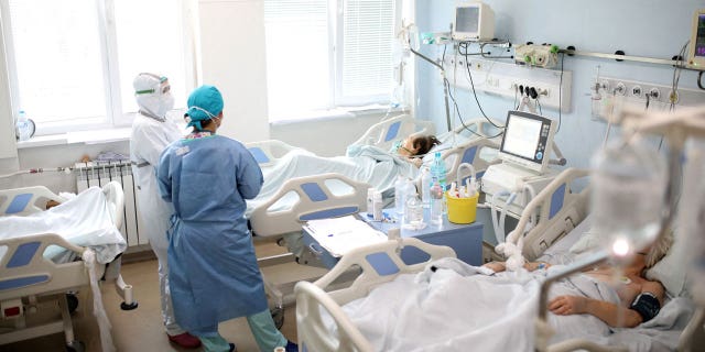 Medics tend to coronavirus disease patients at the Intensive Care Unit of Alexandrovska hospital in Sofia, Bulgaria, on Jan. 29, 2022.