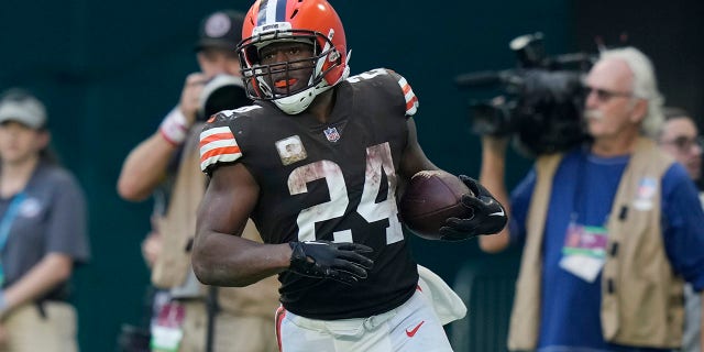 Cleveland Browns running back Nick Chubb (24) scores a touchdown during the second half of an NFL football game against the Miami Dolphins, Sunday, Nov. 13, 2022, in Miami Gardens, Florida.