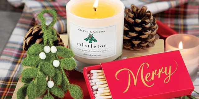 Add some holiday cheer to your home with a Mistletoe Candle from Olive and Cocoa. The hand-crafted box also serves as a decorative piece.