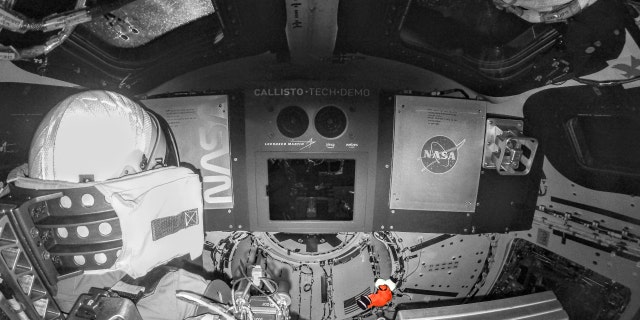 Snoopy, the zero-gravity indicator for NASA's Artemis I flight test, floats in space on November 20, 2022, while attached to its tether on the Orion spacecraft. In this enhanced image, Snoopy stands out in a custom orange spacesuit, while Orion's interior has been shaded black and white for contrast. The character's space suit is inspired by the suit astronauts will wear during launch and re-entry to Orion on future missions to the Moon. NASA has shared a partnership with Charles M. Schulz and Snoopy since the Apollo missions and the relationship continues under Artemis. Snoopy was selected as the zero-gravity symbol for flight because of the inspiration and excitement the character has provided for human spaceflight for more than 50 years.