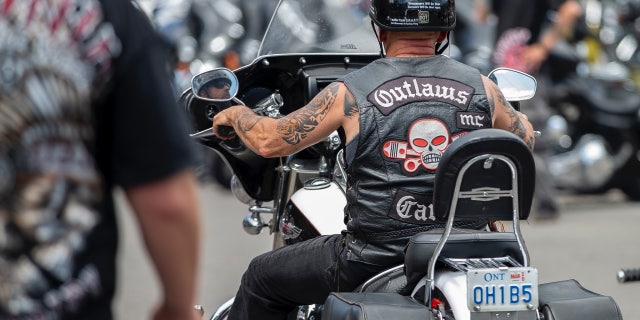 Members of the Outlaws motorcycle gang were among thousands of bikers and motorcycle enthusiasts crowd the streets of Port Dover, Ontario, for the Friday the 13th gathering on July 13, 2018.