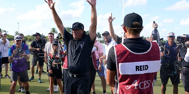 Pat Perez celebrates after the 4 Aces GC team captained by Dustin Johnson won the LIV Golf Team Championship at Trump National Doral Golf Club, Oct. 30, 2022, in Florida.