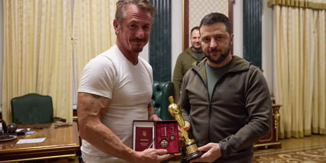 Actor and director Sean Penn on Tuesday gave Ukrainian President Vladimir Zelenskyy one of his Oscars as a symbol of strength and asked the leader to keep it until his country can defeat Russia.