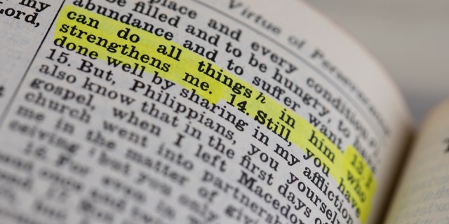 The controversial verse about the parking space is Philippians 4:13, pictured here highlighted in a Bible.