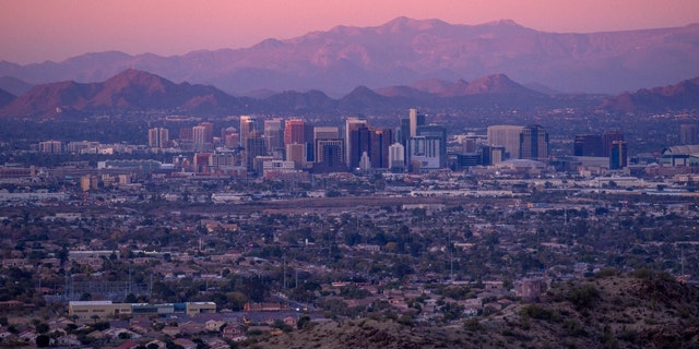 A view of the Phoenix skyline at sunset.