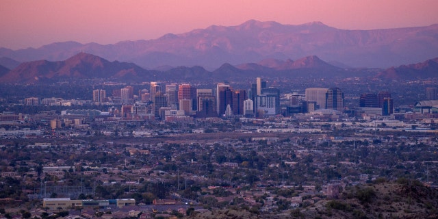 A view of the Phoenix skyline at sunset.