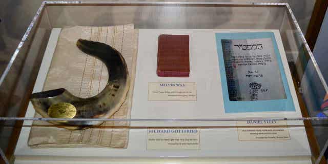 Artifacts are displayed on Nov. 13, 2022, at the New Light Memorial Chapel in Shaler, Pennsylvania, including religious items used by the three members of New Light Congregation who were among the 11 victims of the massacre on Oct. 27, 2018.
