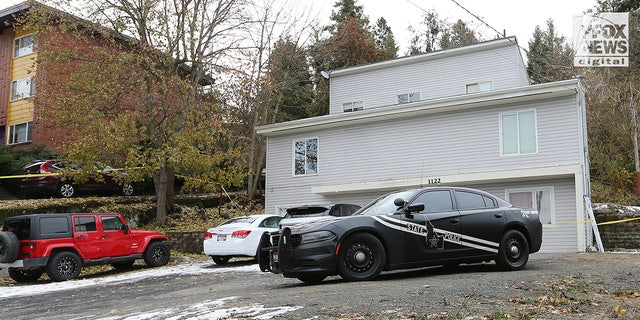 Police vehicles are displayed at the scene of the Idaho quadruple homicide.