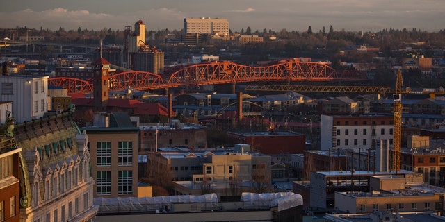 The downtown skyline and the Broadway Bridge are shown in Portland, Oregon.