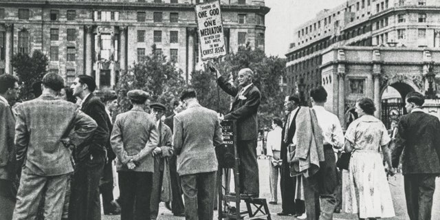 Open-air preaching has a long history in Great Britain.  Pictured is a Christian preacher at the entrance to Hyde Park in London in the 1930s.