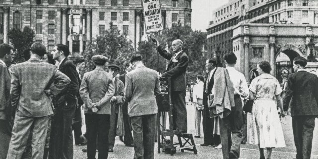 Open-air preaching has a long history in Great Britain.  Pictured is a Christian preacher at the entrance to Hyde Park in London in the 1930s.