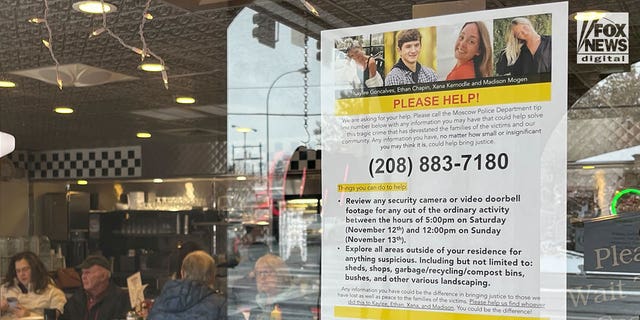 A sign posted in a local diner in Moscow Idaho on Monday, Nov. 28, 2022, asks the public to look for clues in the quadruple homicide of four students from the University of Idaho.