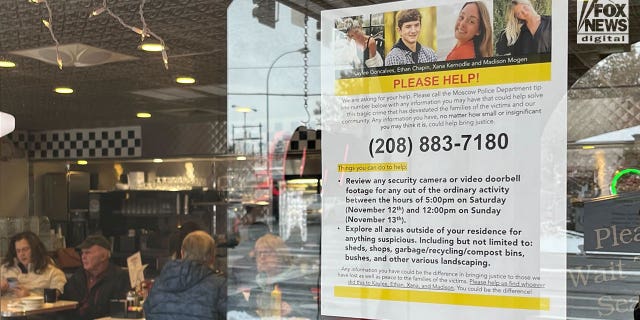 A sign posted in a local diner in Moscow Idaho on Monday, Nov. 28, 2022, asks the public to look for clues in the quadruple homicide of four students from the University of Idaho.