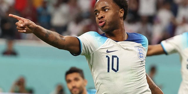 England's Raheem Sterling celebrates after scoring during a Group B match against Iran at the 2022 FIFA World Cup at the Khalifa International Stadium in Doha, Qatar on November 21, 2022.