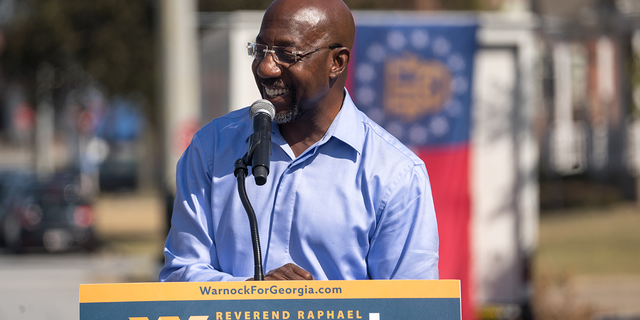 Sen. Raphael Warnock speaks to supporters outside the Liberty Theater on Oct. 8, 2022, in Columbus, Georgia.