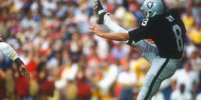 Ray Guy of the Los Angeles Raiders punts the ball during an NFL game against the Washington Redskins at RFK Stadium in Washington, D.C., on Oct. 2, 1983.