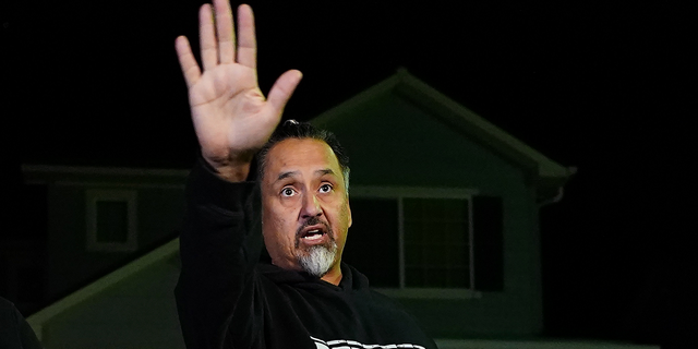 Richard Fierro gestures while speaking to reporters outside his home about the Club Q shooting in Colorado Springs, Colorado.