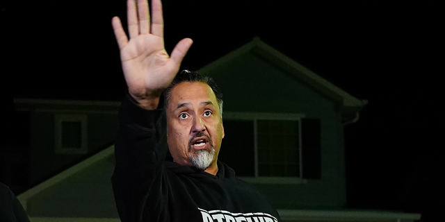 Richard Fierro gestures as he talks to reporters outside his home about the Club Q shooting in Colorado Springs, Colorado.