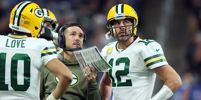 Green Bay Packers quarterback Aaron Rodgers (12) views a replay on the big screen with Green Bay Packers head coach Matt LaFleur during an NFL football game between the Detroit Lions and the Green Bay Packers in Detroit, Michigan USA, on Sunday, November 6, 2022.