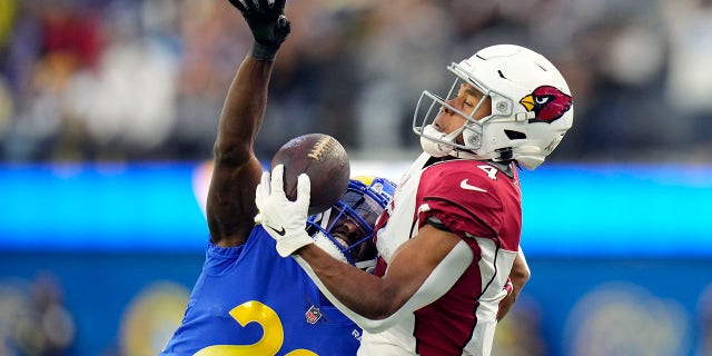 Arizona Cardinals wide receiver Rondale Moore (4) makes a one-handed catch in front of Los Angeles Rams cornerback David Long Jr. (22) during the second half of an NFL football game Sunday, Nov. 13, 2022, in Inglewood, Calif.