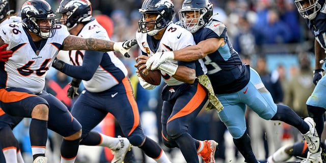 Dylan Cole (53) of the Tennessee Titans sacks Russell Wilson (3) of the Denver Broncos during the fourth quarter of the Titans 17-10 win at Nissan Stadium in Nashville, Tennessee on Sunday, November 13, 2022.