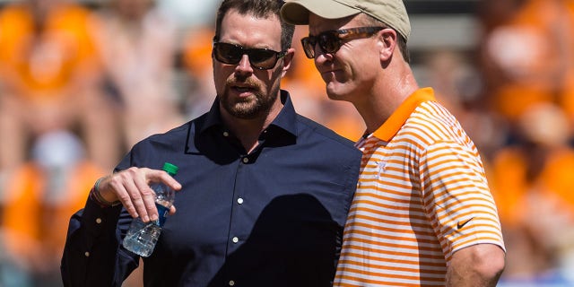 Peyton Manning, right, and Ryan Leaf talk before a college football game between the Tennessee Volunteers and Georgia State Panthers on Aug. 31, 2019, at Neyland Stadium in Knoxville, Tennessee.