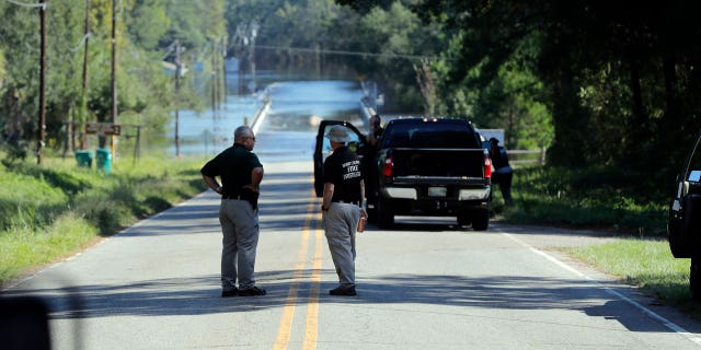 Responders are gathering near where two people drowned when they were trapped in a Horry County Sheriff's van as they crossed a flooded bridge over the Little Pee Dee River on Highway 76 while the flood waters rebounded increased by Hurricane Florence on September 19, 2018 Marion County, SC