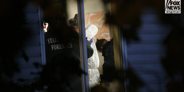 Forensic team search a home in Moscow, Idaho on Monday, November 14, 2022, where four University of Idaho students were killed over the weekend in an apparent quadruple homicide. 