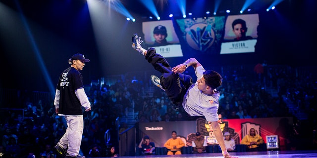 B-boy Victor of the USA competes against Yuki of Japan in the semifinal of the Red Bull BC One World Finals in New York City on November 12, 2022.