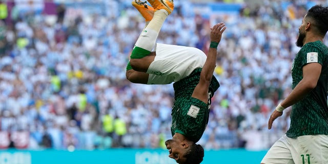 Salem Al-Dawsari of Saudi Arabia celebrates after scoring his team's second goal during the World Cup group C soccer match between Argentina and Saudi Arabia at Lusail Stadium in Lusail, Qatar, Tuesday, November 22, 2022. . 