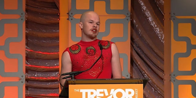 Sam Brinton, a non-binary former Biden administration official, speaks in New York City on June 11, 2018, wearing clothes that Tanzanian fashion designer Asya Khamsin alleges are hers. Brinton has not been charged with any crime related to Khamsin's complaint.