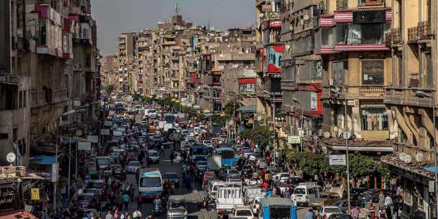 People crowd a street hours before a curfew in Cairo, Egypt, April 14, 2020. Saudi Arabia agreed on Nov. 29, 2022 to extend the terms of an aid package of 5 billion dollars in Egypt in March.