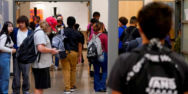 Westwood High School students make their way to classes, Oct. 18, 2022, in Mesa, Arizona.
